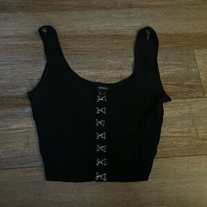 black tank top with silver detailing down the middle